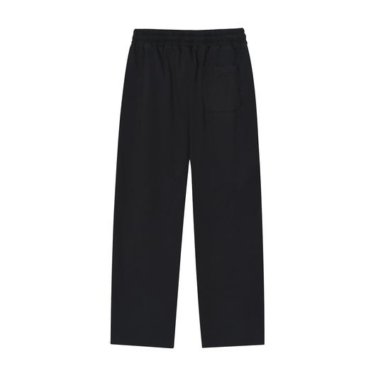 ODMPOD Motion Sweatpants in black, featuring a relaxed fit and elastic waistband, shown on a model.