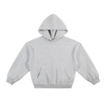 ODMPOD Presence Hoodie displayed on a model, featuring a comfortable fit and stylish design in a casual urban setting.