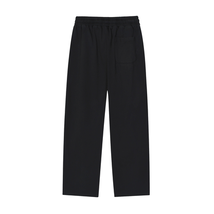 ODMPOD Motion Sweatpants in black, featuring a relaxed fit and elastic waistband, shown on a model.