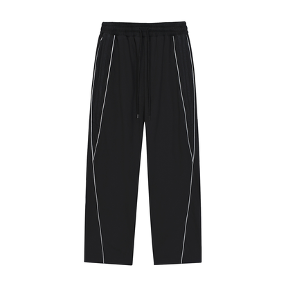 ODMPOD Motion Sweatpants in gray with elastic waistband and tapered cuffs, shown on a model for a comfortable, sporty look.